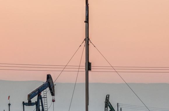 Oil wells and flame coming from flare stack