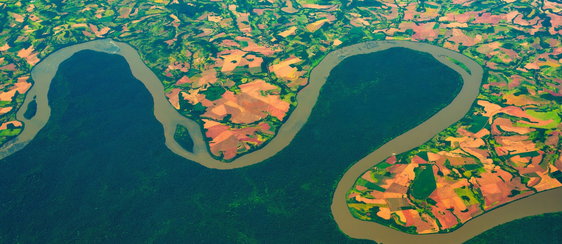 Aerial photo of forests, river, and farmland